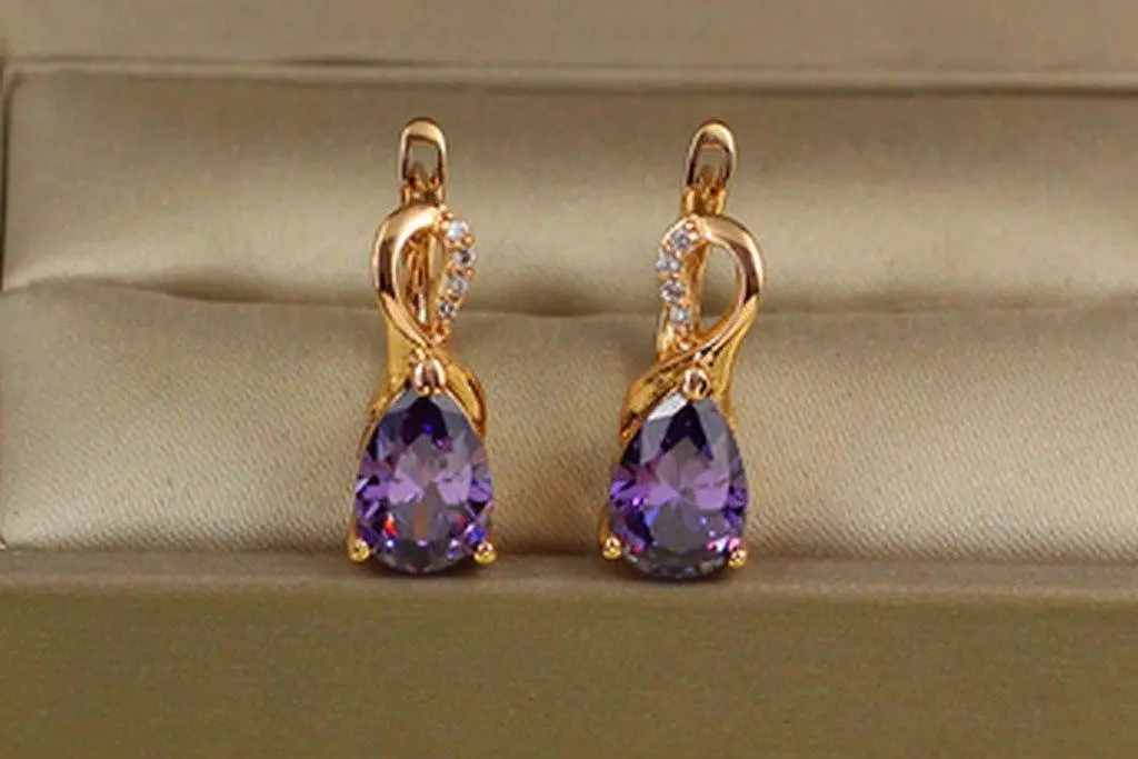 Сережки Xuping Jewelry Скандинавія з фіолетовим каменем 1,8 см золотисті