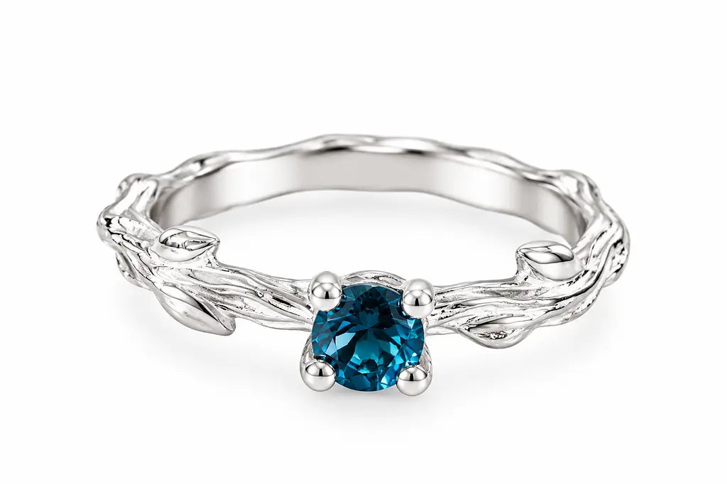 Золота каблучка «Гілочка» з топазом London Blue К-0848 15.5