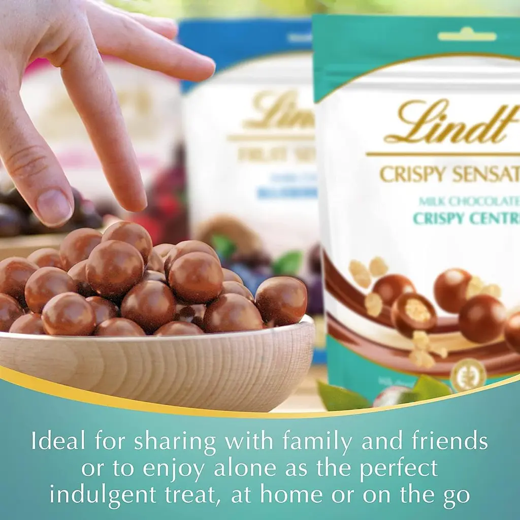 Шоколадні кульки Lindt CRISPY SENSATION Milk Chocolate Crispy Centre Pouch 140г - фото 4