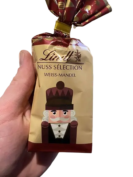 Шоколадні цукерки з мигдалем Lindt Nuss Selection Weiss Mandel 100 г - фото 4