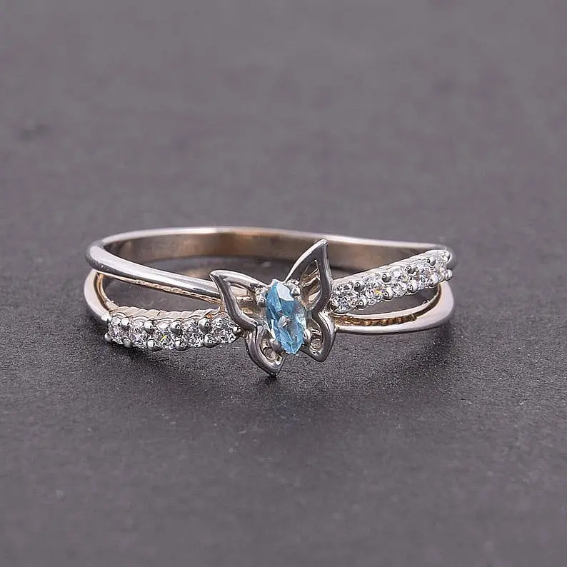 Каблучка з білого золота з топазом 19 K-0287