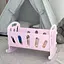 Іграшкове ліжечко для ляльок з постількою (Рожева) - мініатюра 1